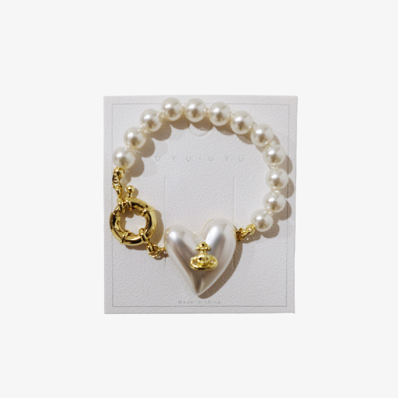 Pulsera con perlas y dije de corazón "Amor eterno"