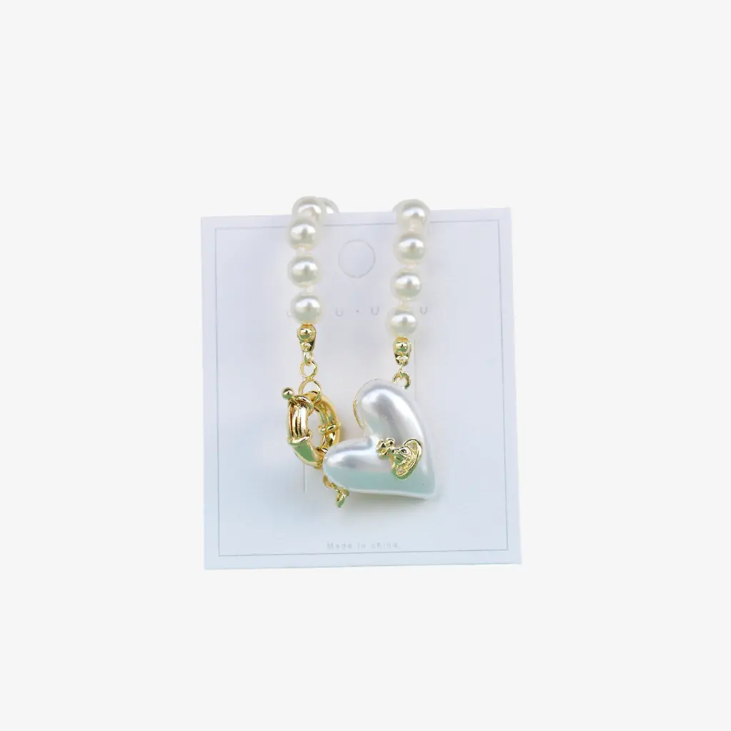 Pulsera con perlas y dije de corazón "Amor eterno"